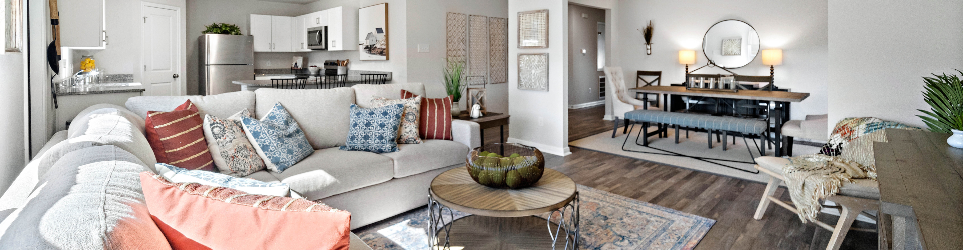 A living room with a couch and a table.