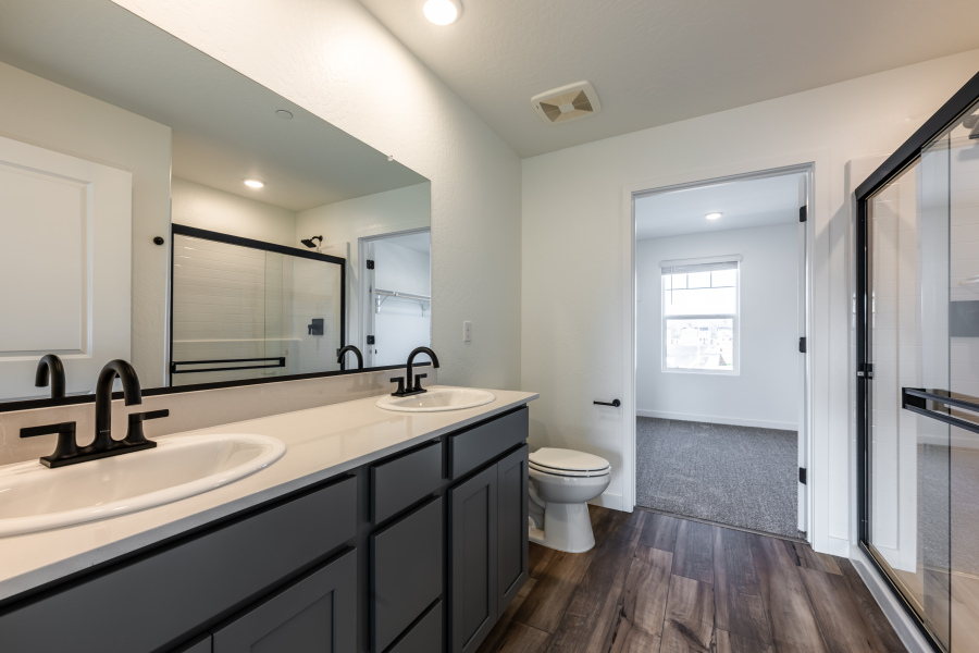 A bathroom with a sink and a toilet.