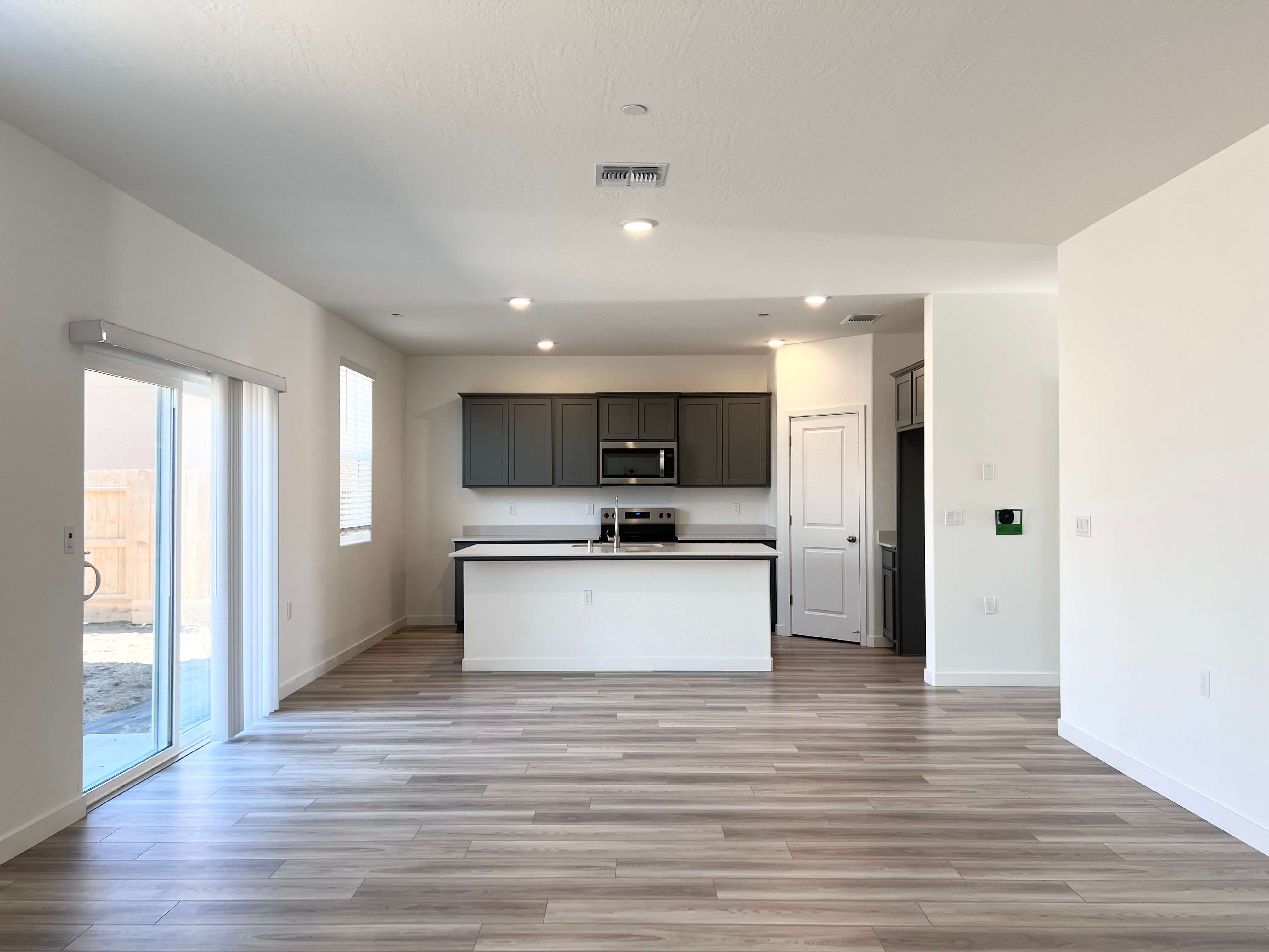 A large kitchen with white cabinets.