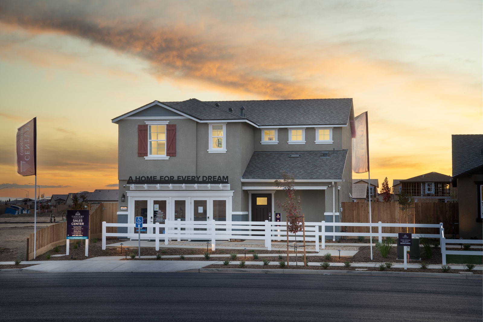 A house with a white picket fence.