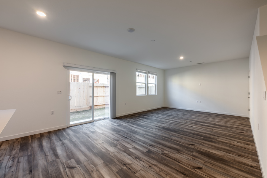 A room with a wood floor and a wood floor.