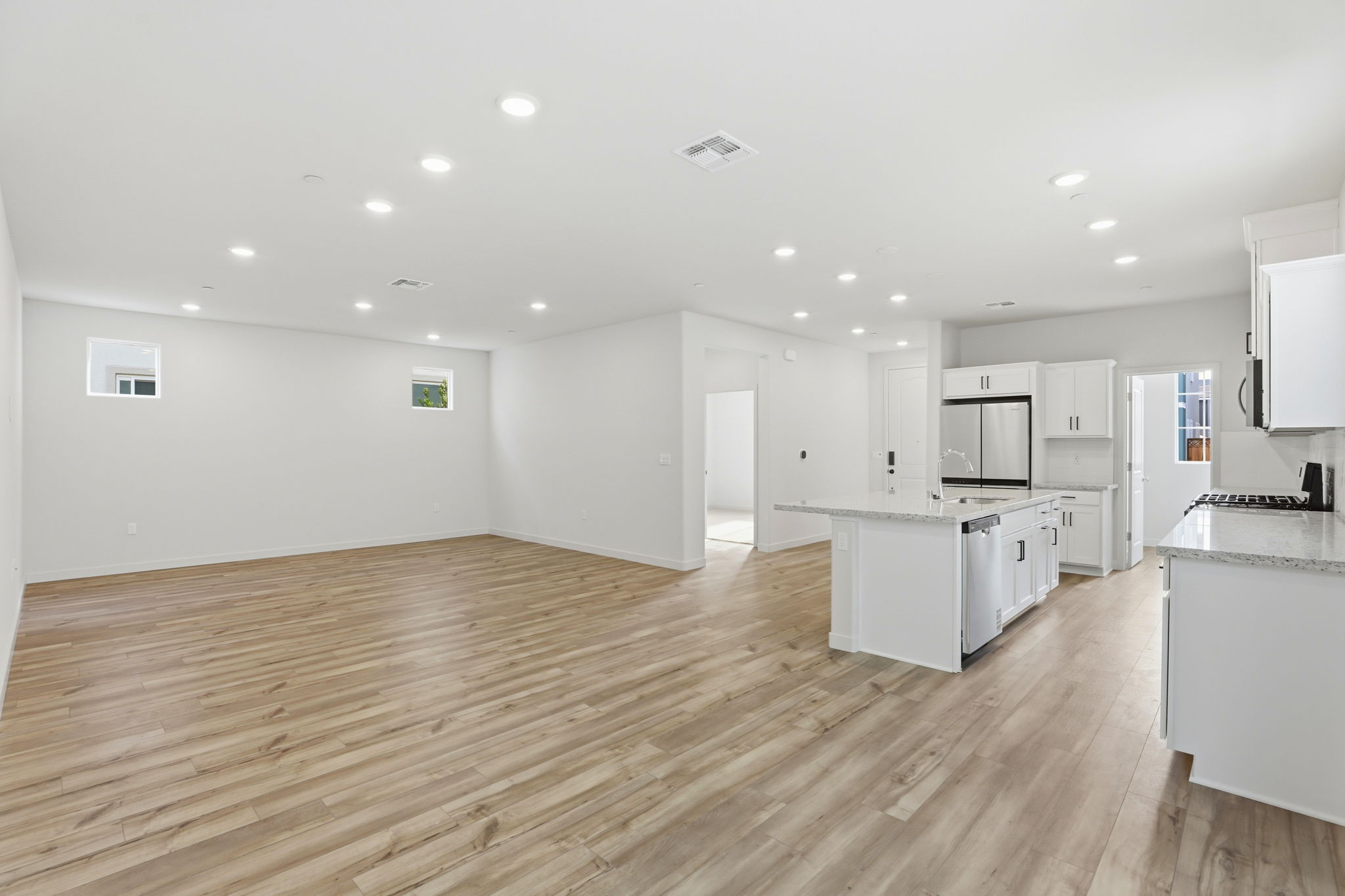 A large kitchen with white cabinets.