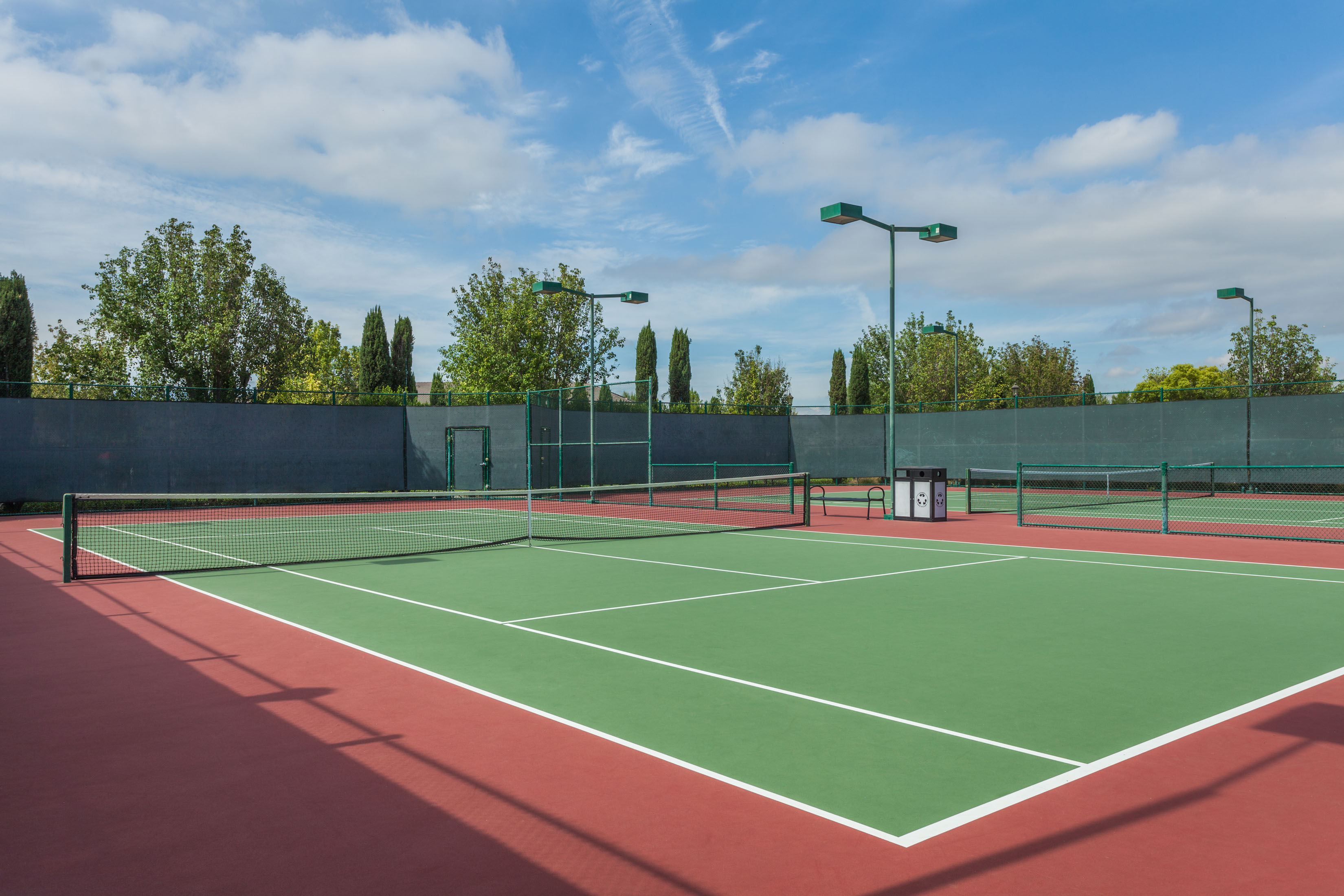 A tennis court with a net.