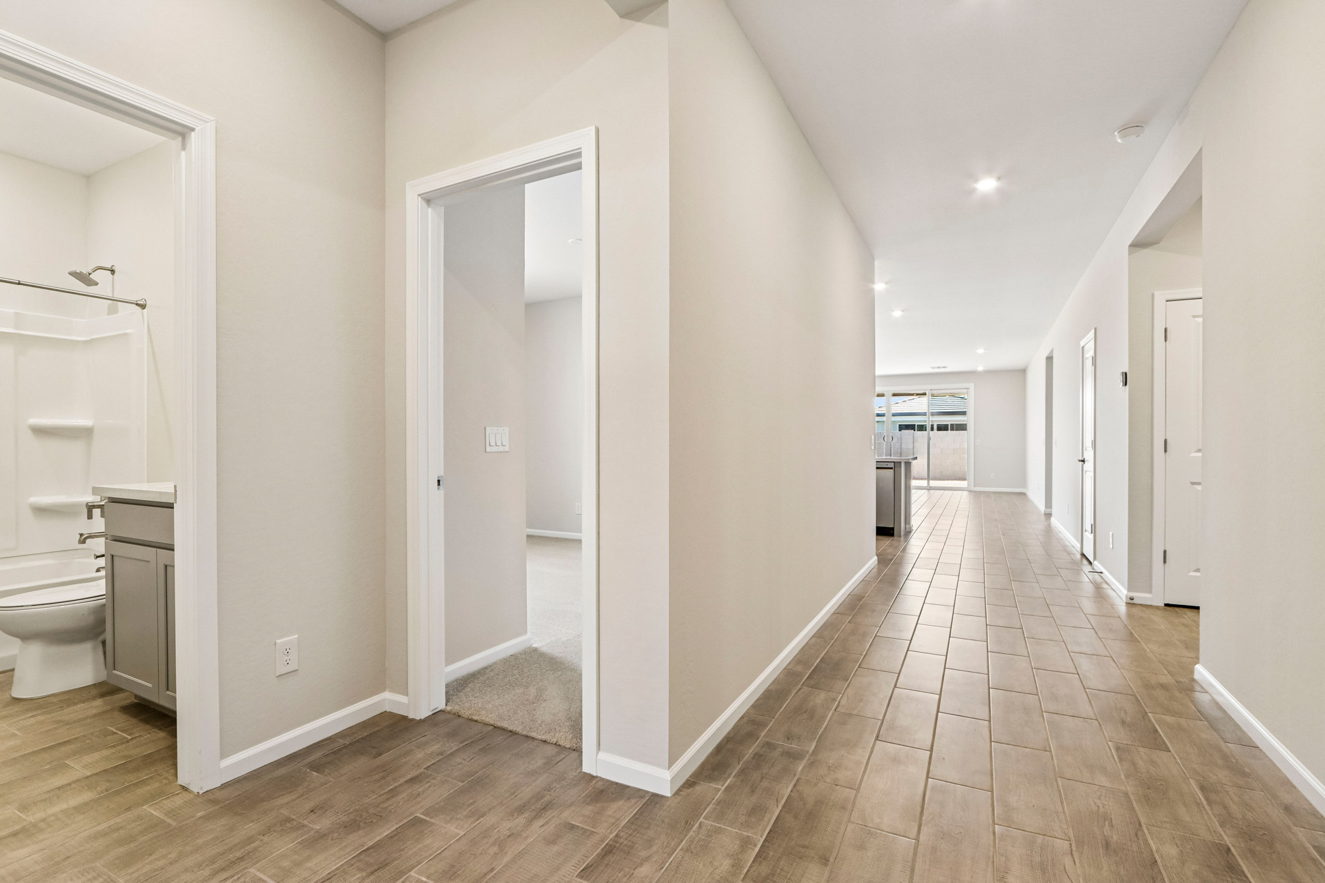 A bathroom with white walls.