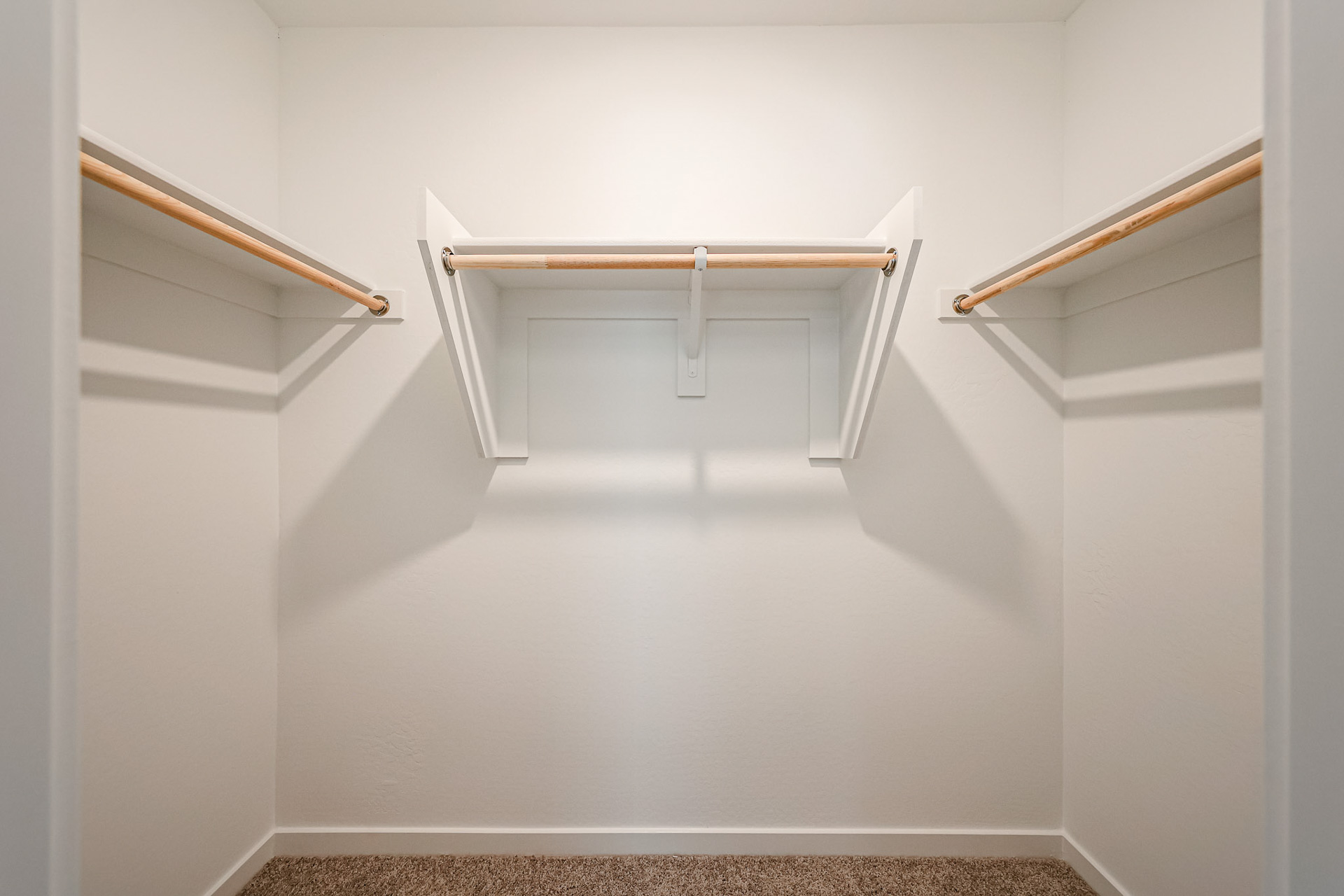 A white staircase with a railing.