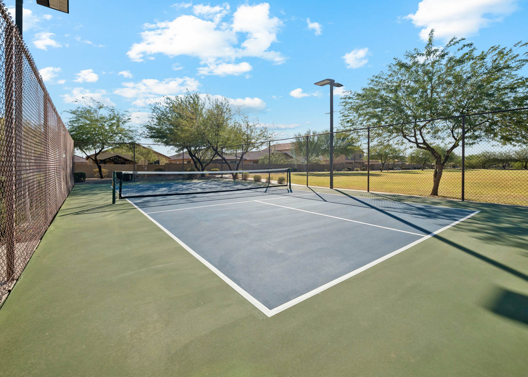A tennis court with a net.