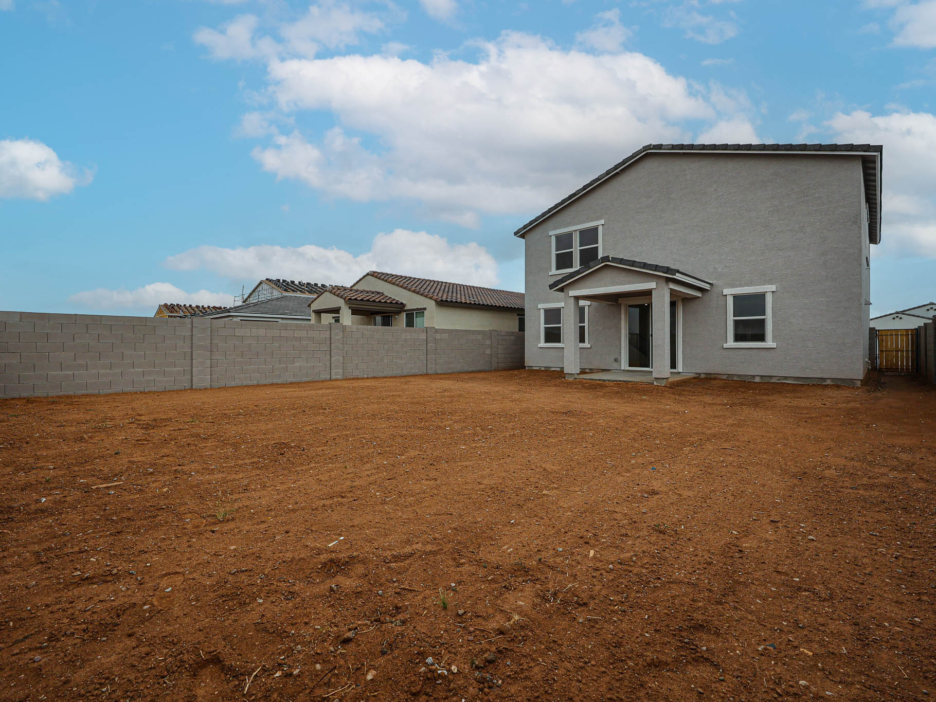 A house with a dirt yard.