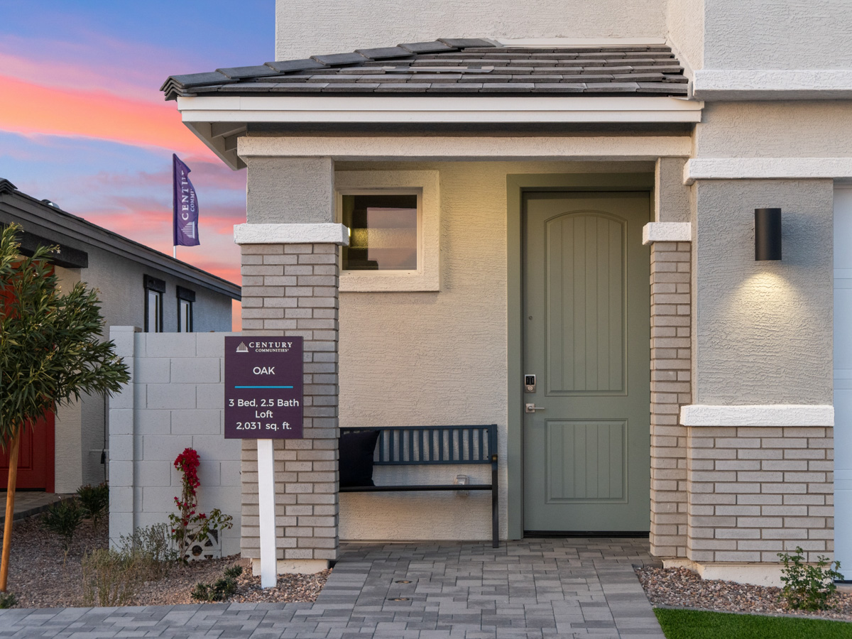 A building with a bench in front.