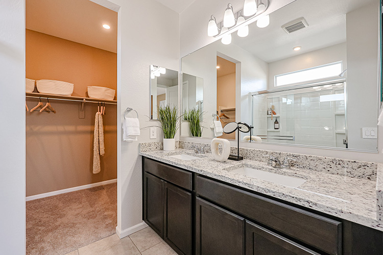 A bathroom with a marble countertop.