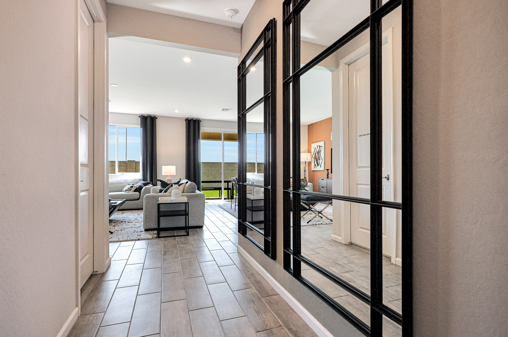 A hallway with glass doors.