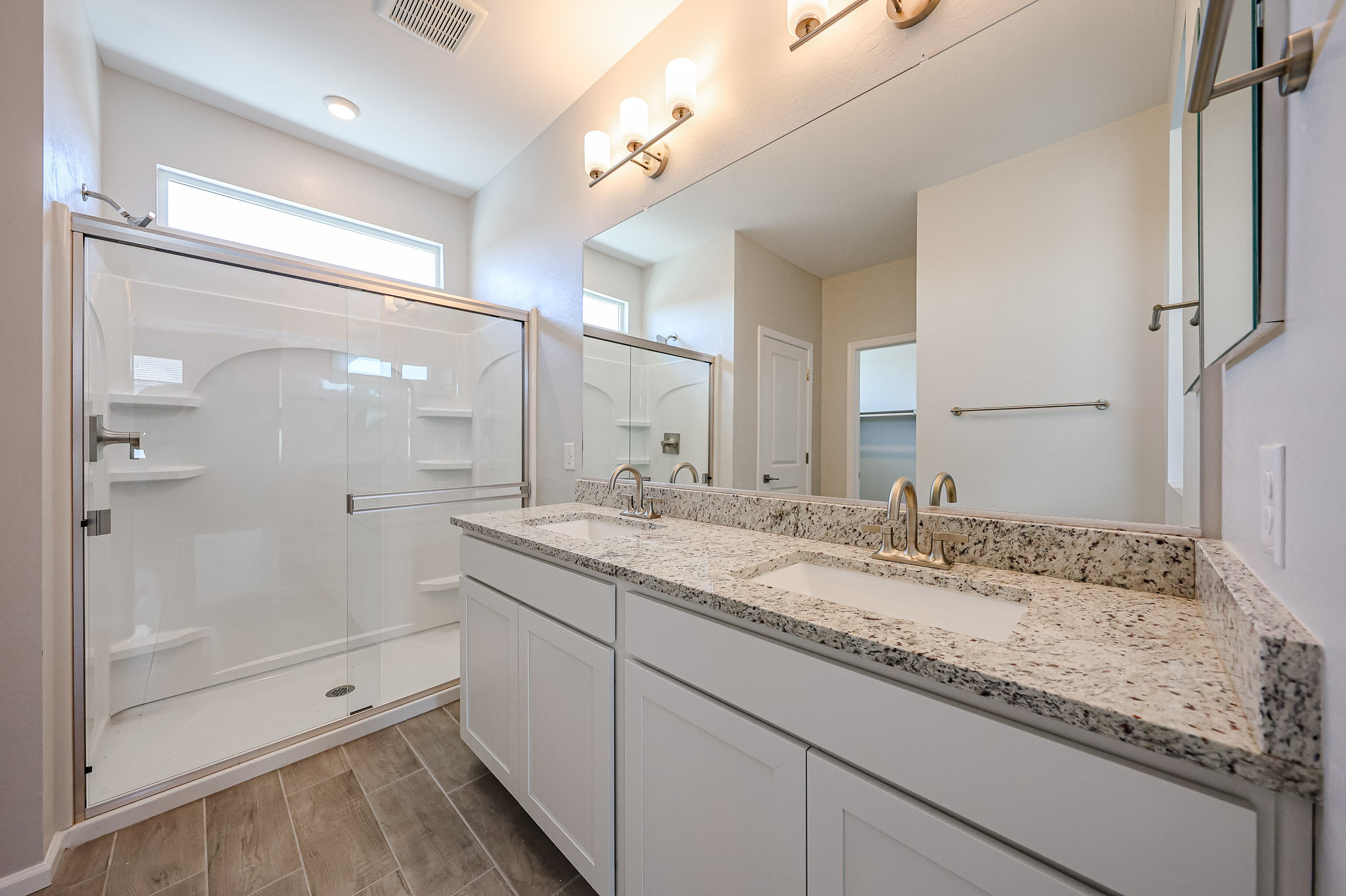 A bathroom with a glass shower.