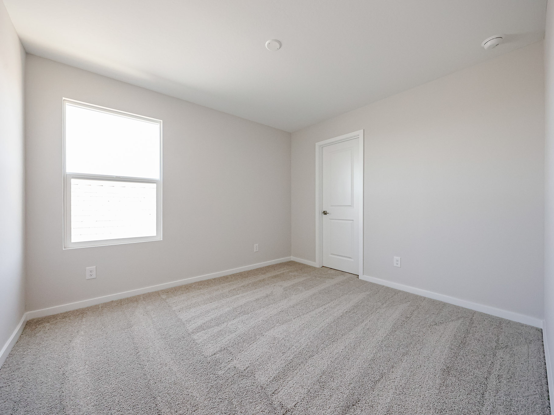 A room with a door and a window.