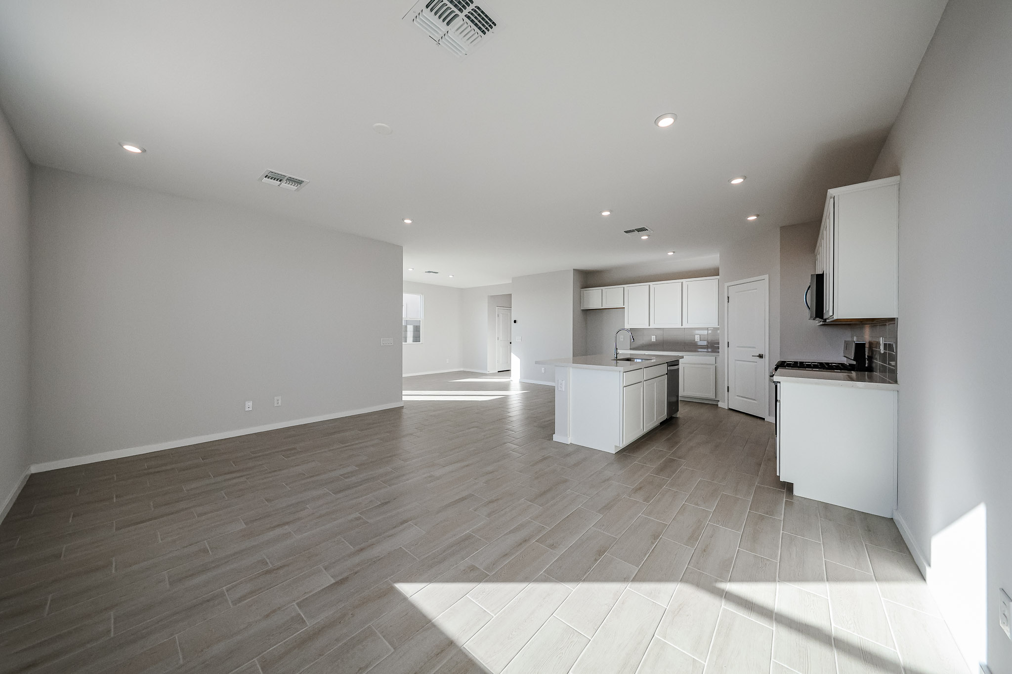 A large kitchen with white cabinets.