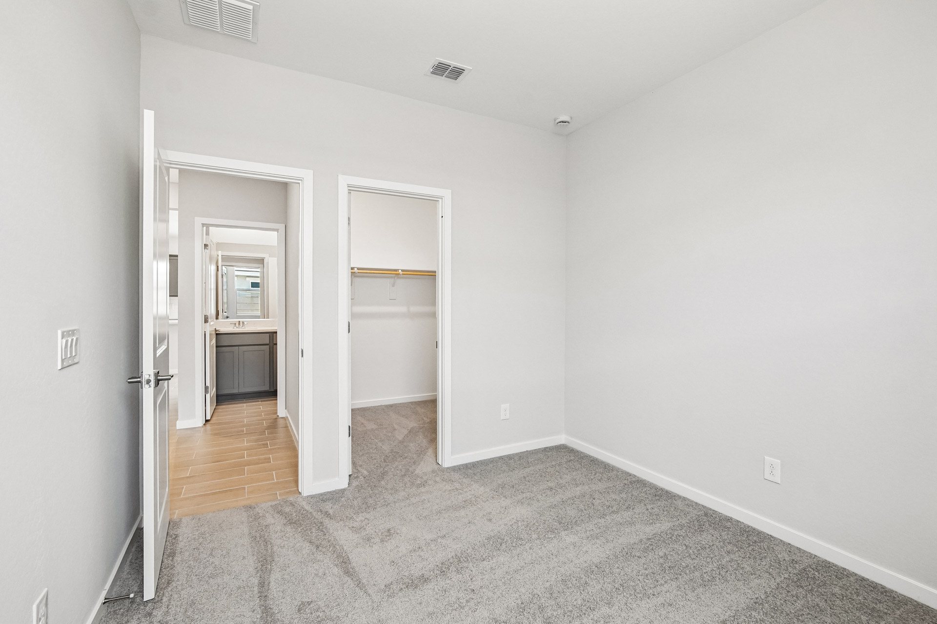 A hallway with white walls.