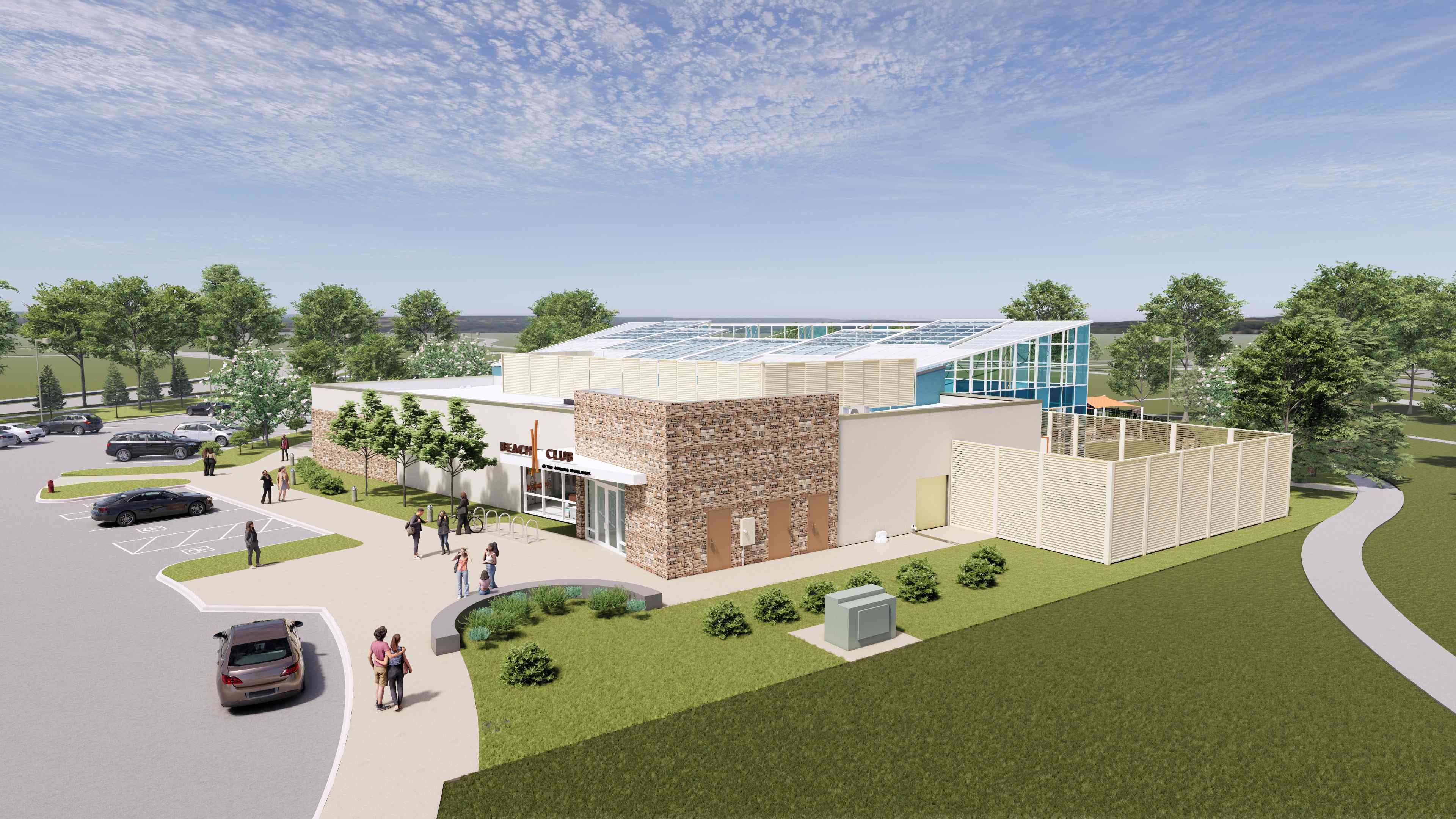 A building with a lawn and cars.