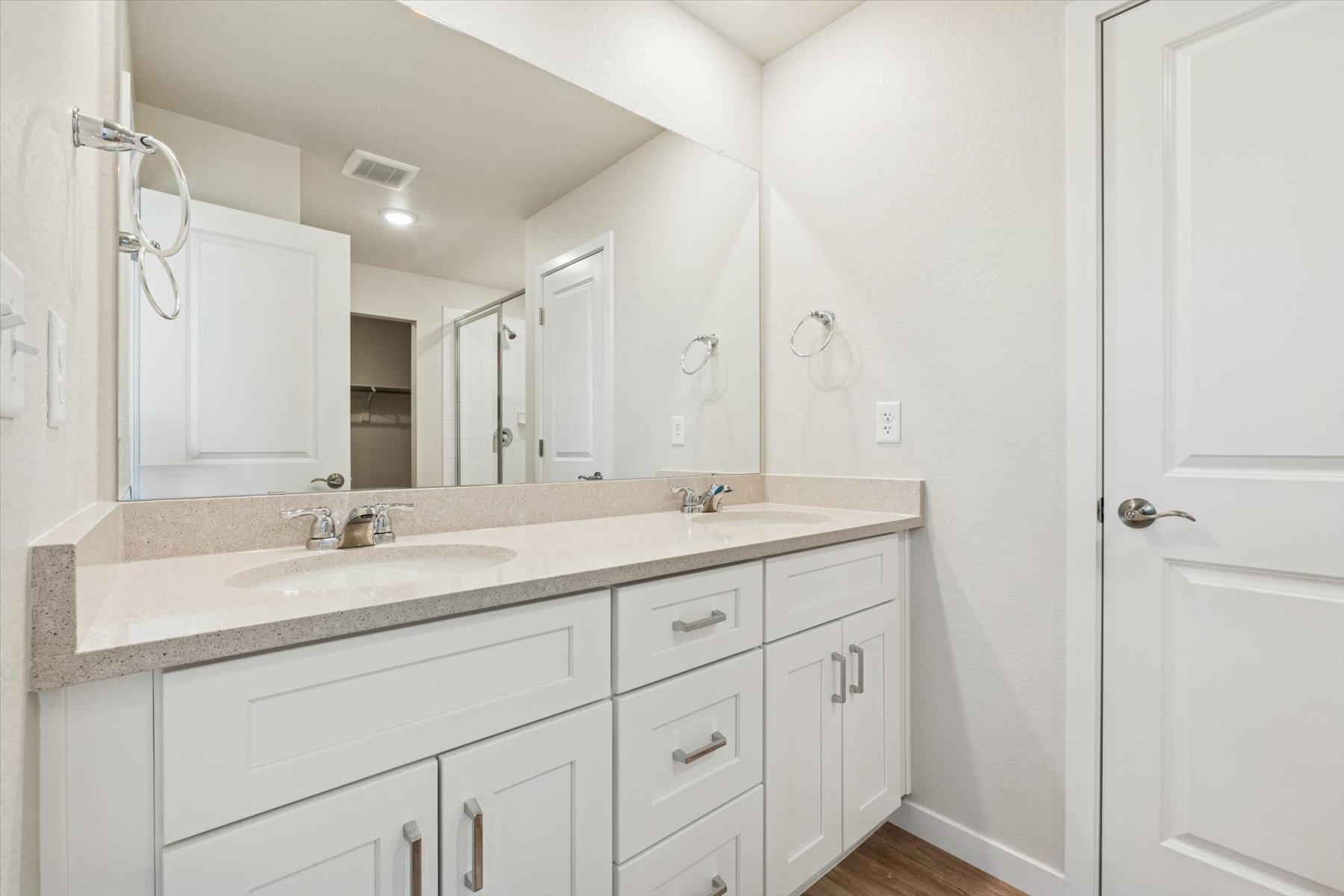 A bathroom with a marble countertop.