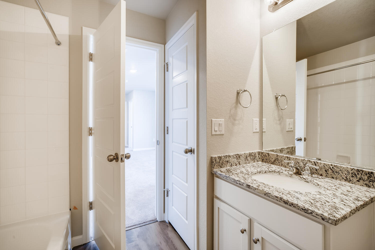 A bathroom with a marble countertop.