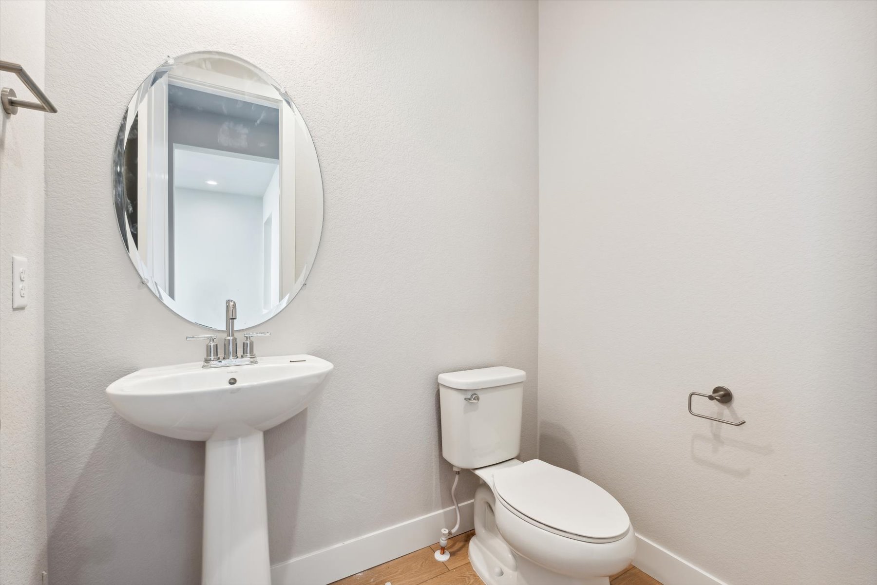 A bathroom with a sink and toilet.