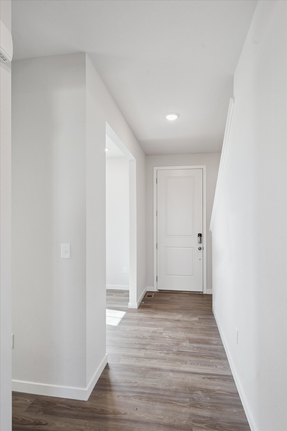 A hallway with white doors.