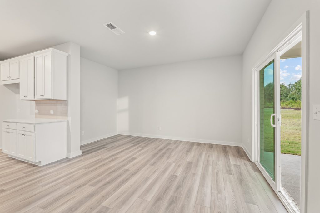 A room with white cabinets.