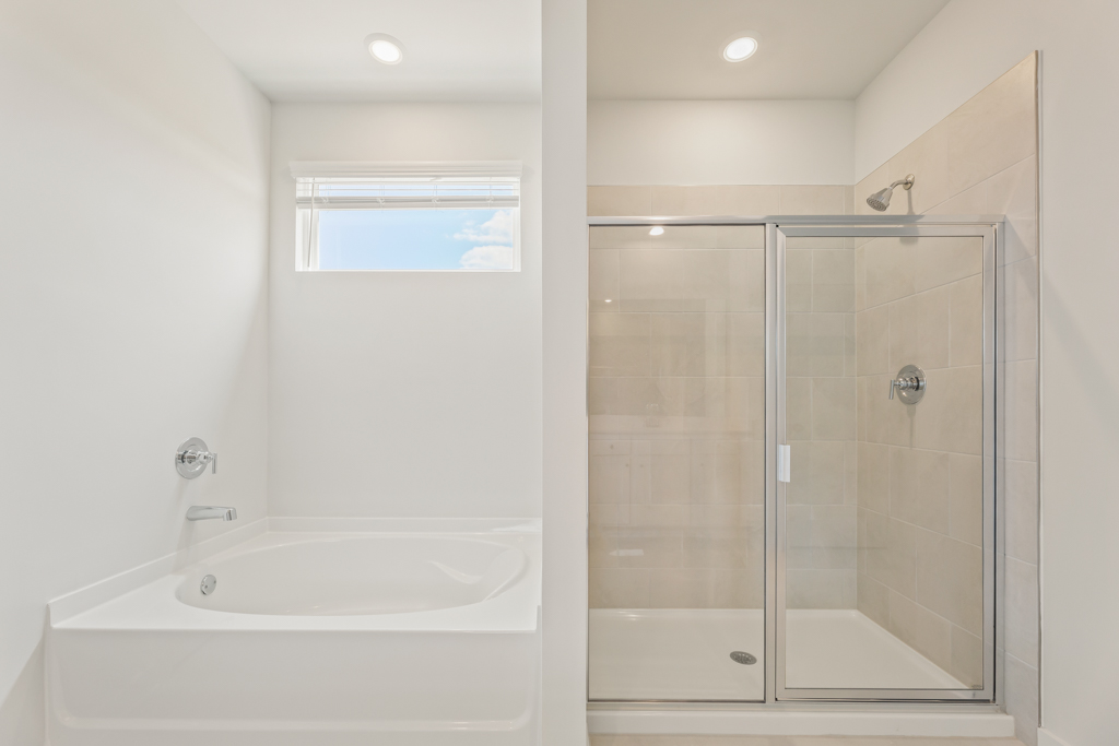 A bathroom with a glass shower.