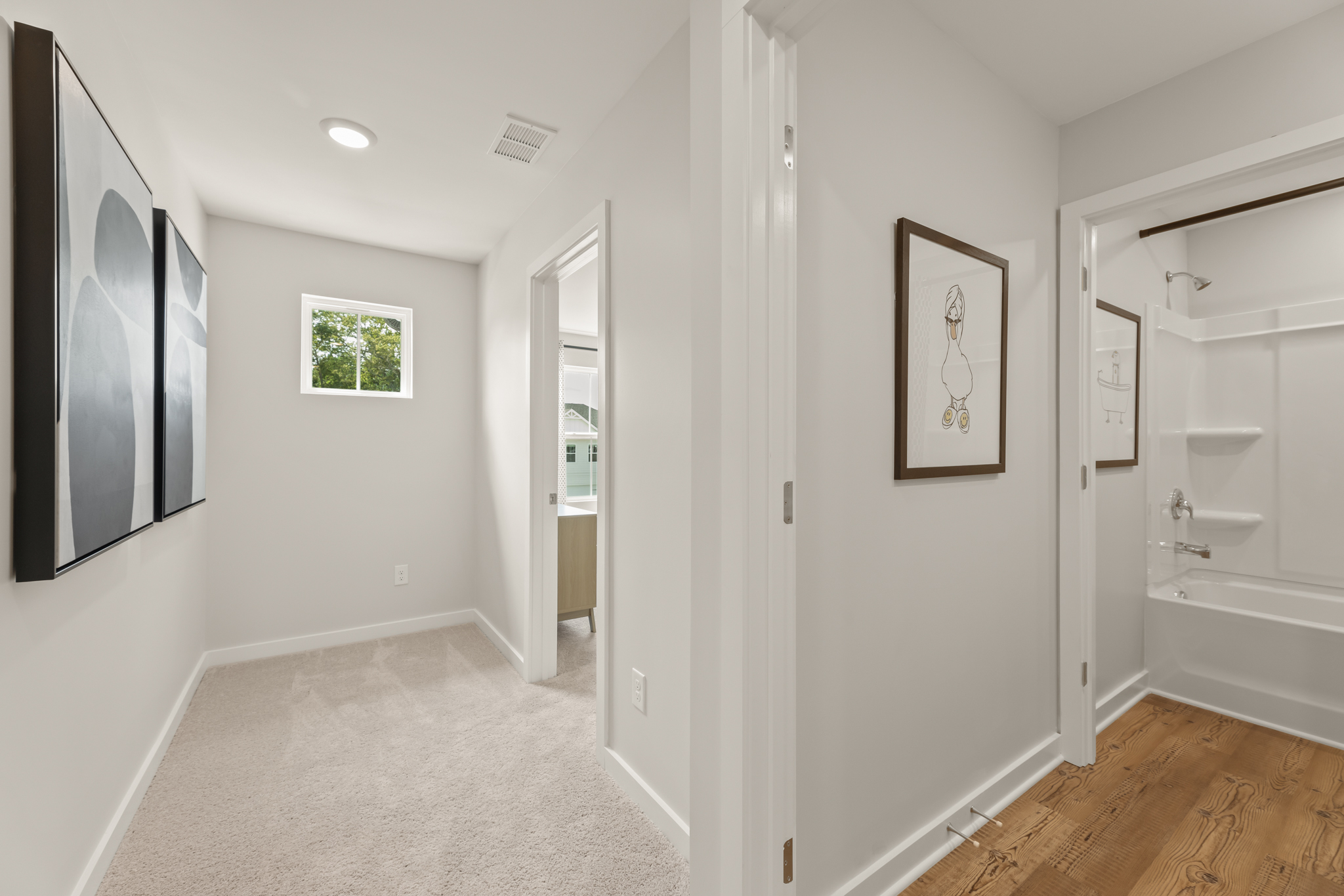A bathroom with white walls.