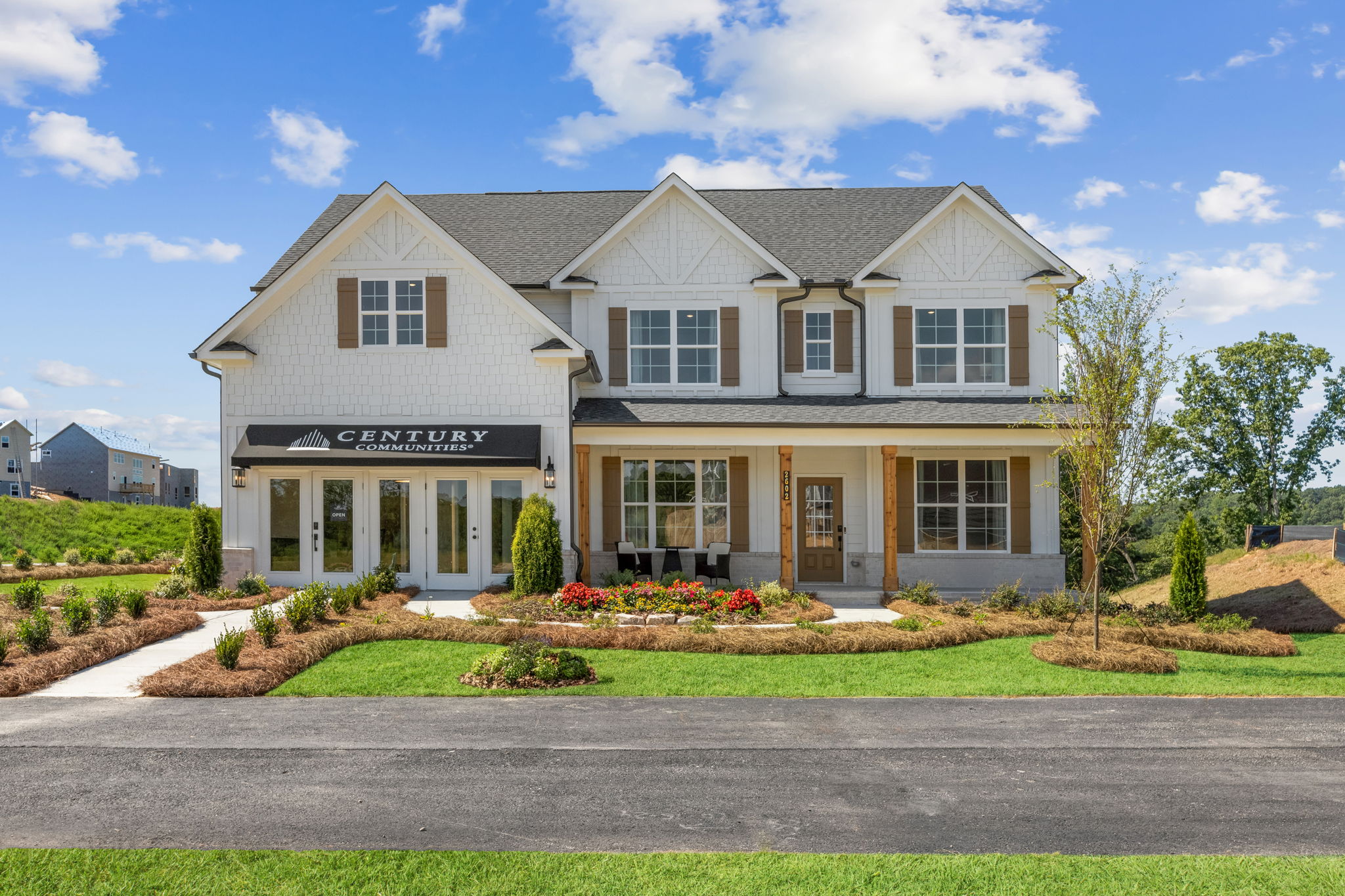 A large white building with a sign.
