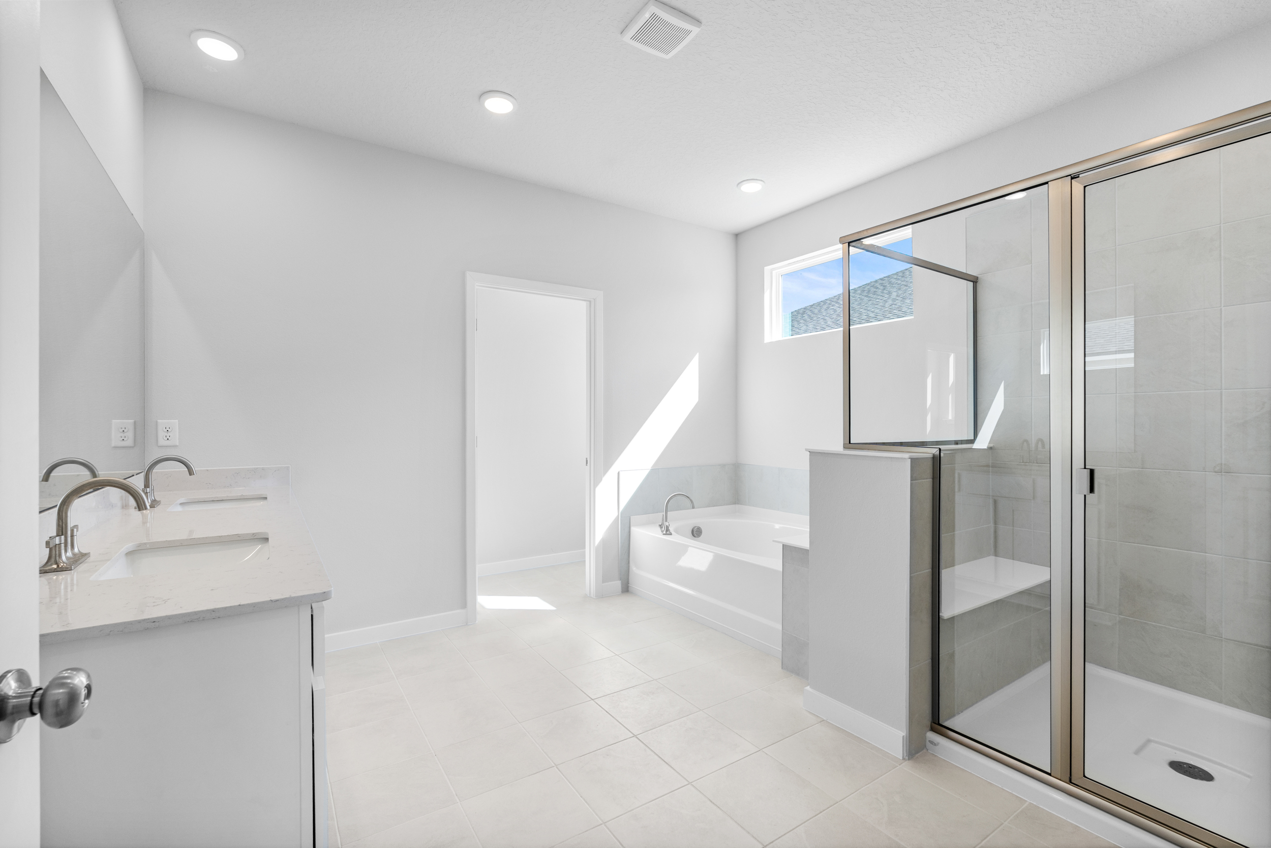 Lot 197 Primary Bathroom with Tub and Shower at Reserve East