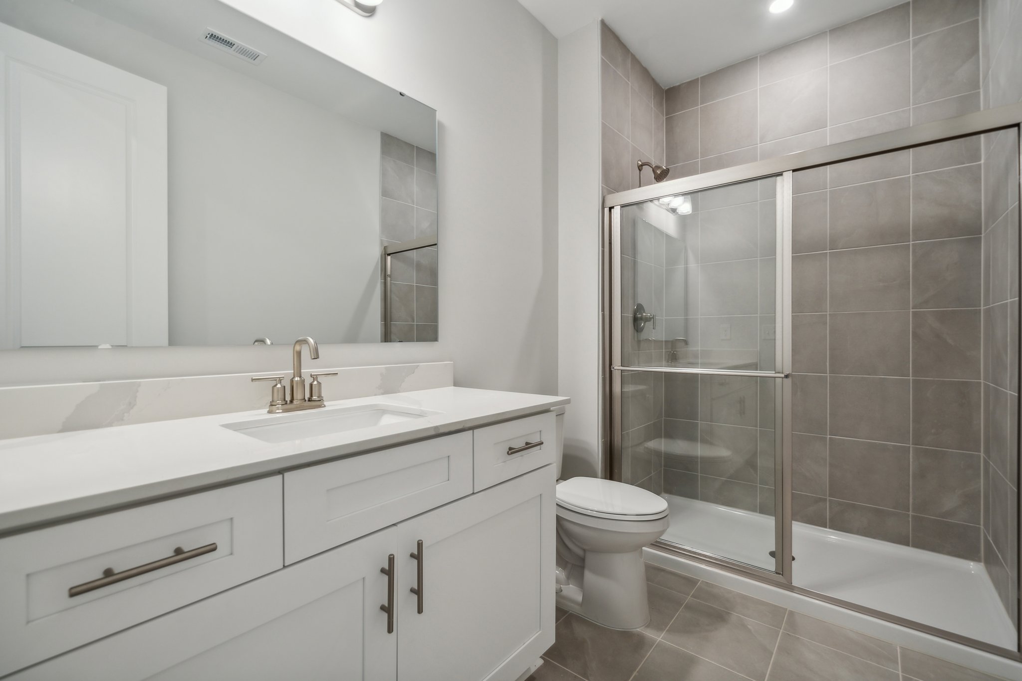 A bathroom with a glass shower.