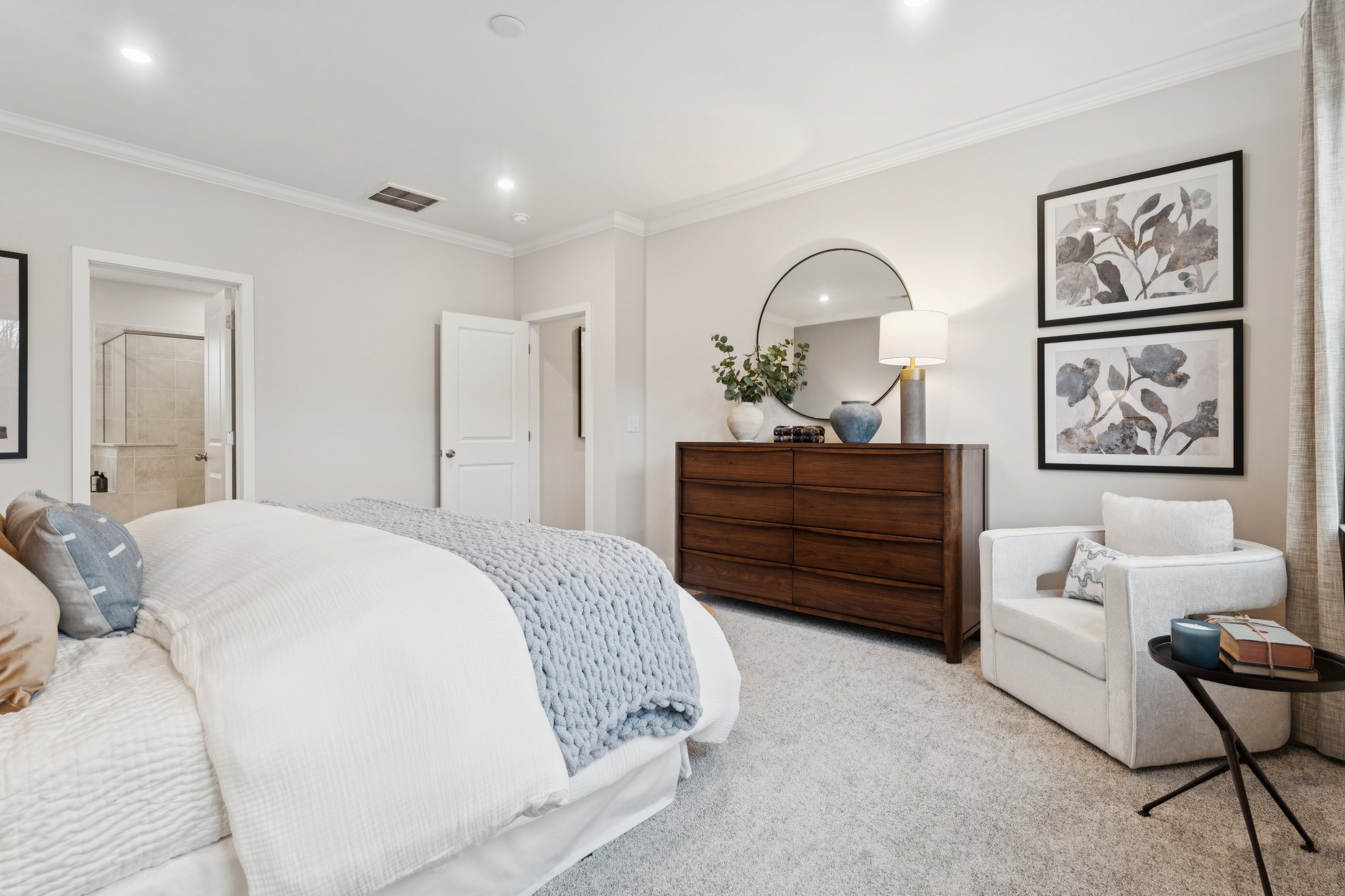 A bedroom with a bed and a couch.