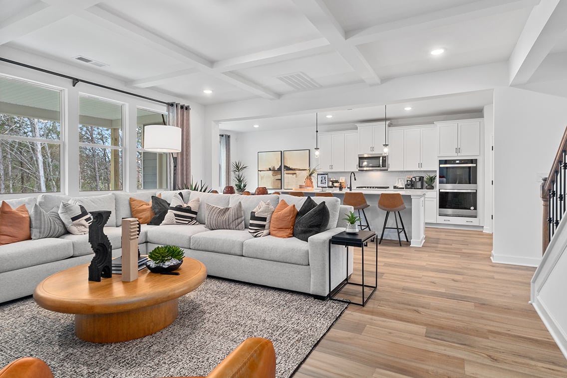 A living room with a couch and a table.