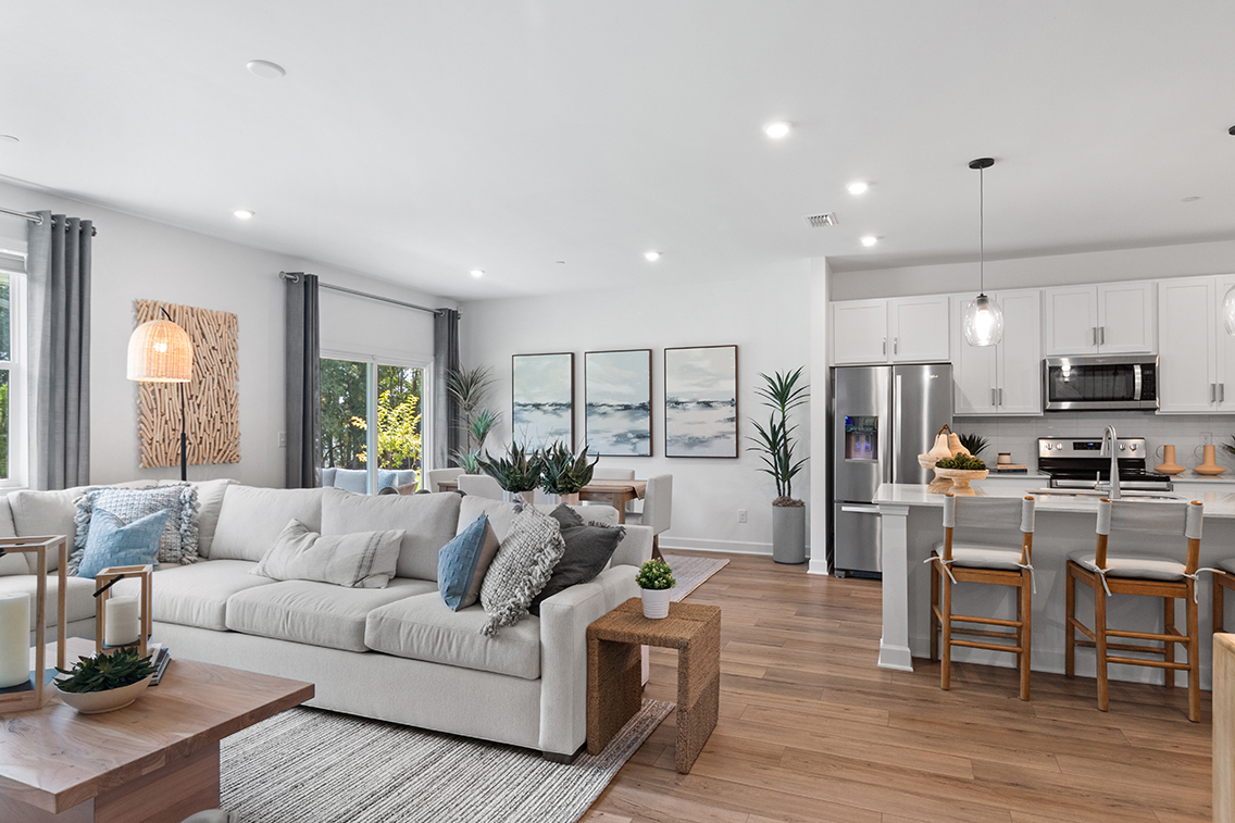 A living room with a couch and a table.