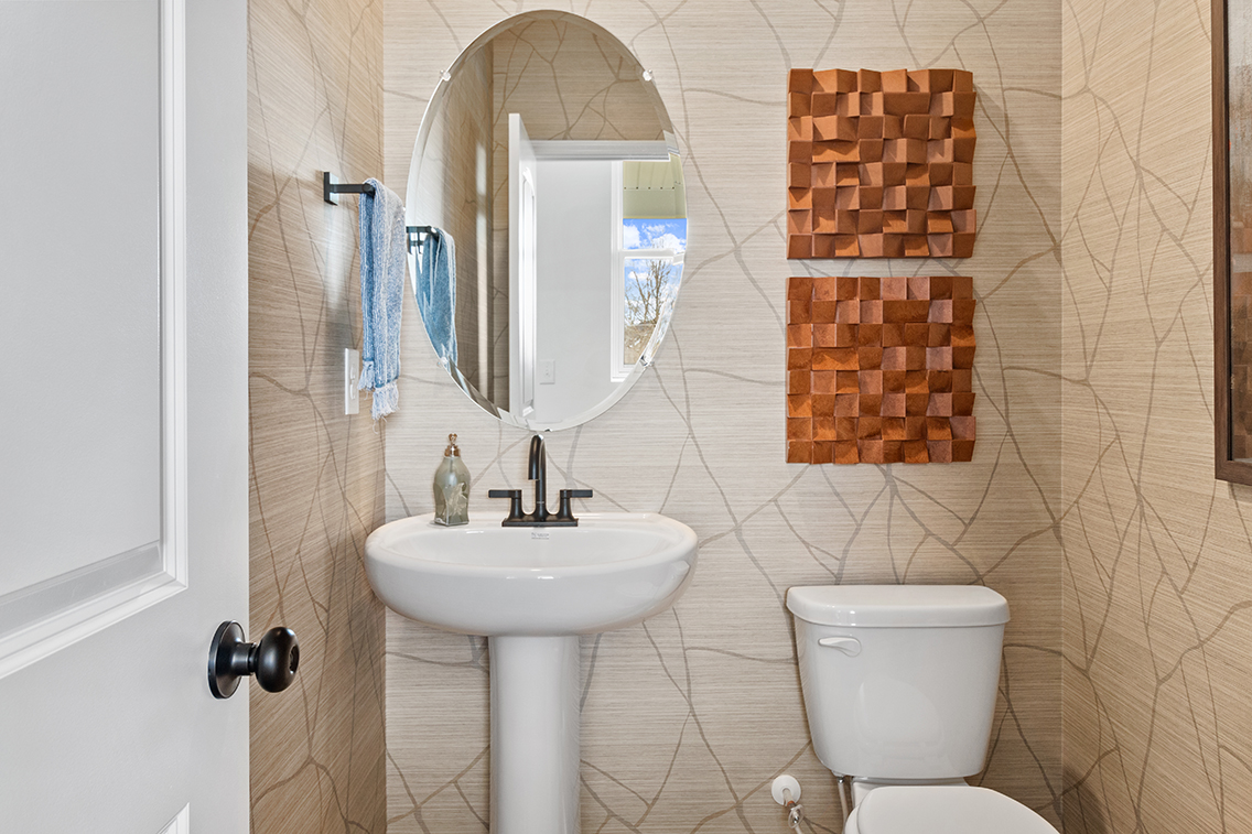 A bathroom with a sink and toilet.