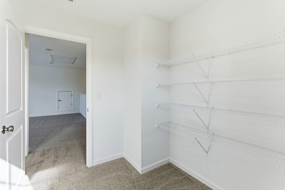 A white staircase in a room.
