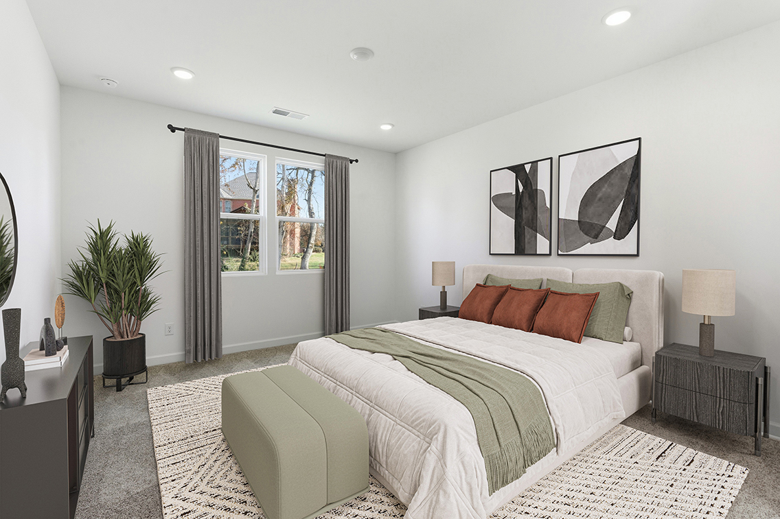 A bedroom with a large bed.