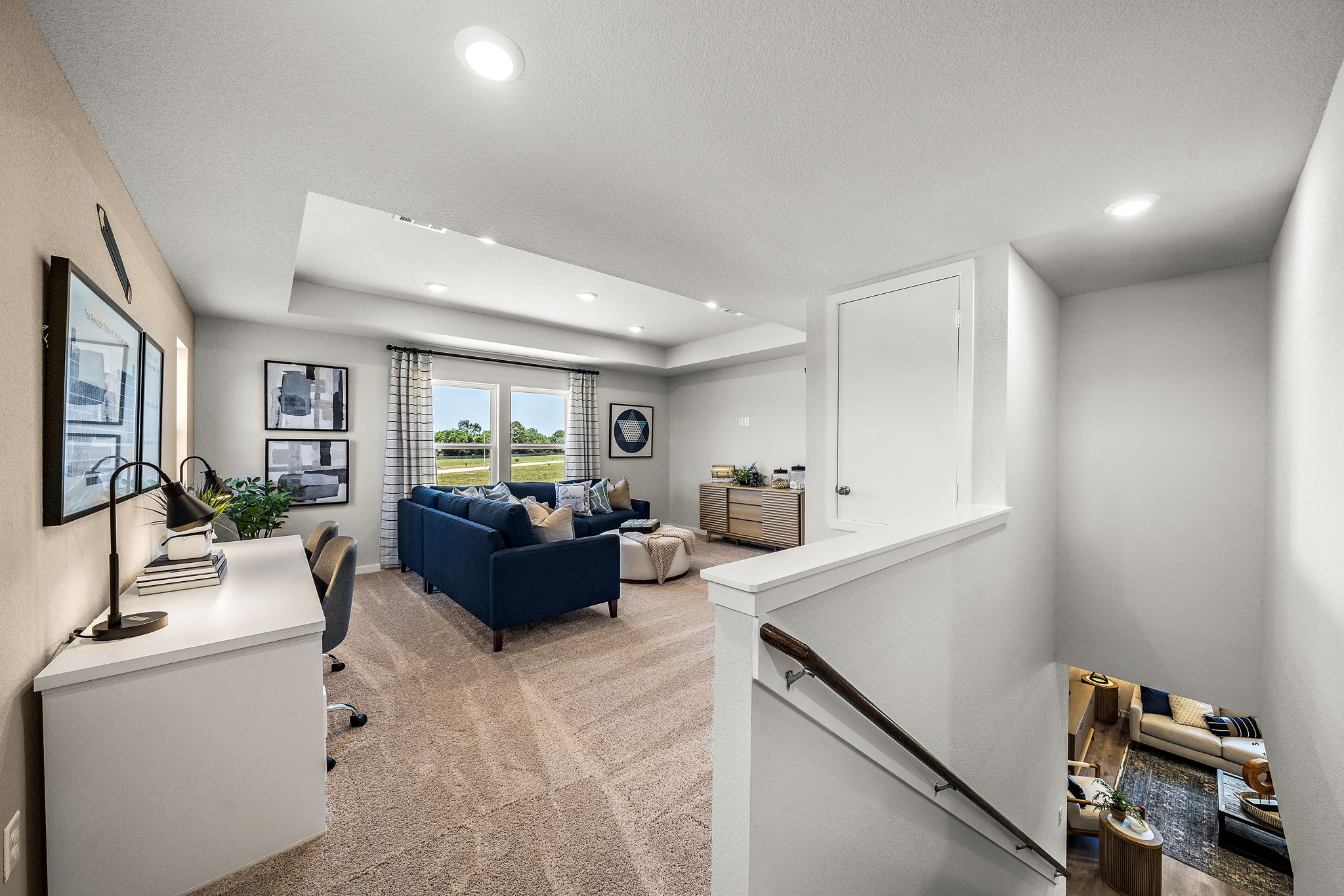A living room with a couch and a table.