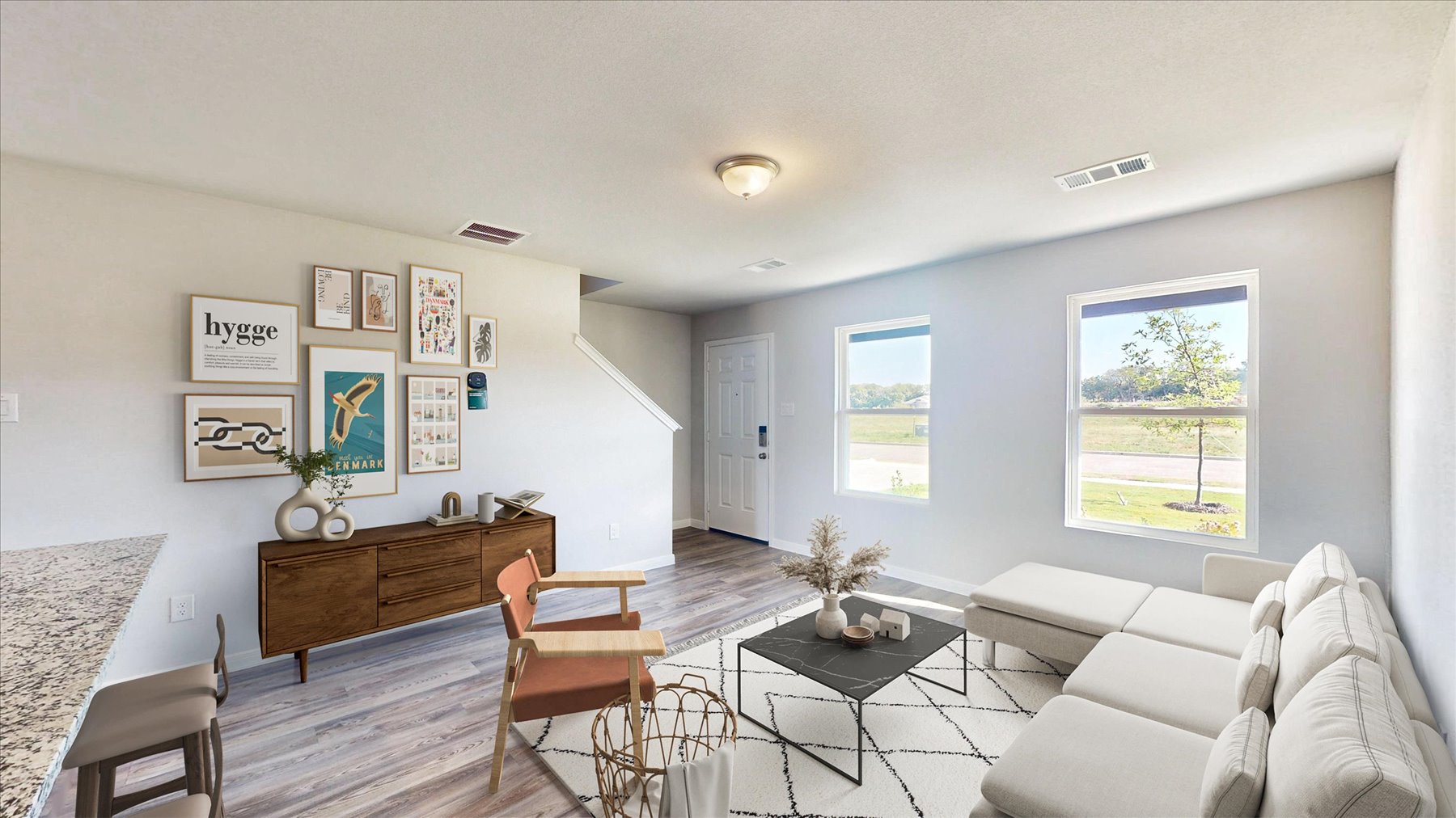 A living room with a couch and a table.