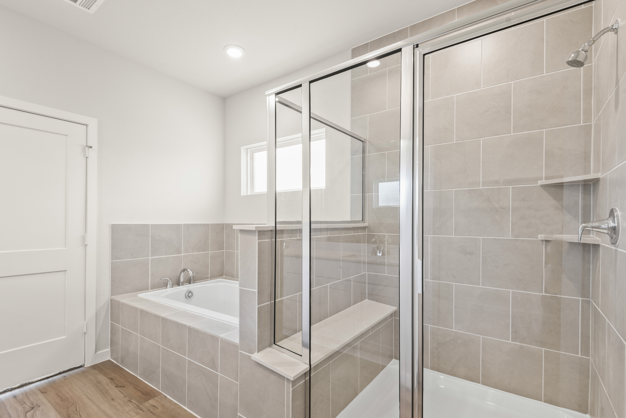 A bathroom with a glass shower.