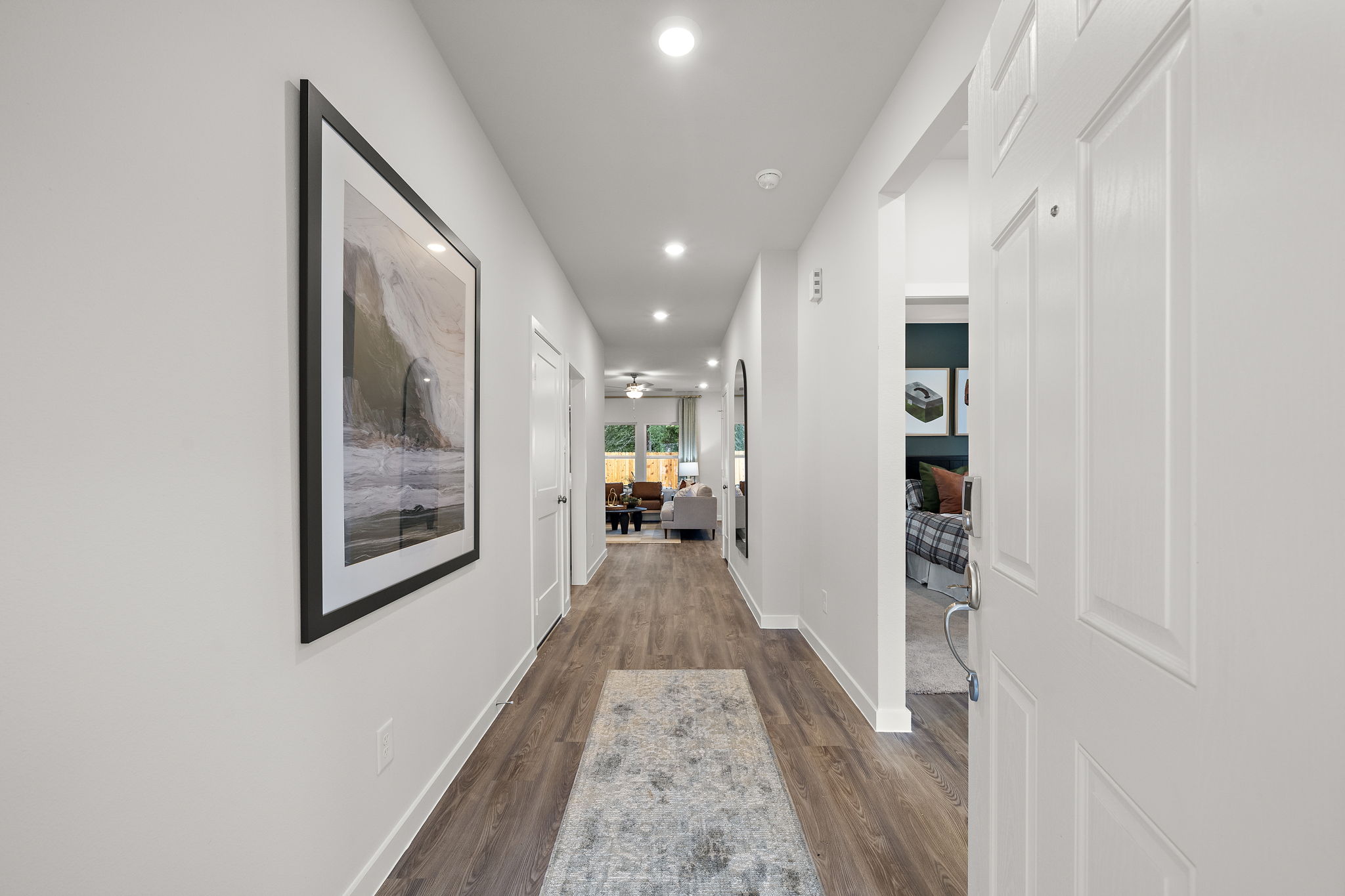 A hallway with white walls.