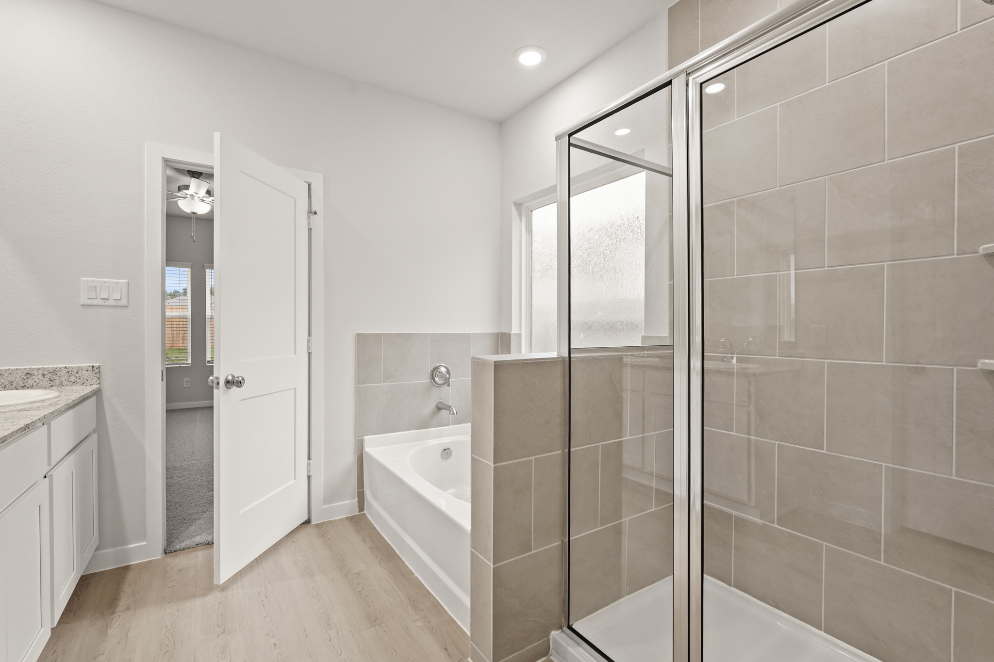 A bathroom with a glass shower.