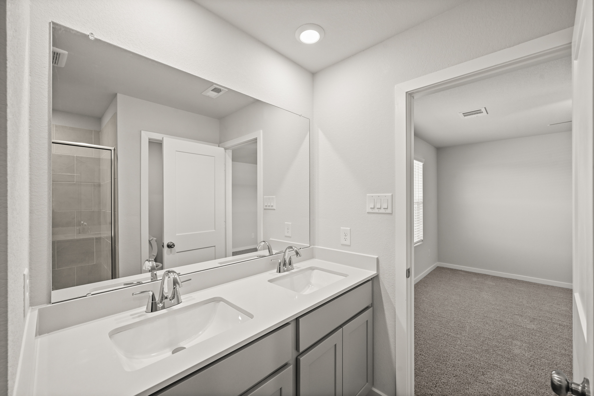 A bathroom with two sinks.