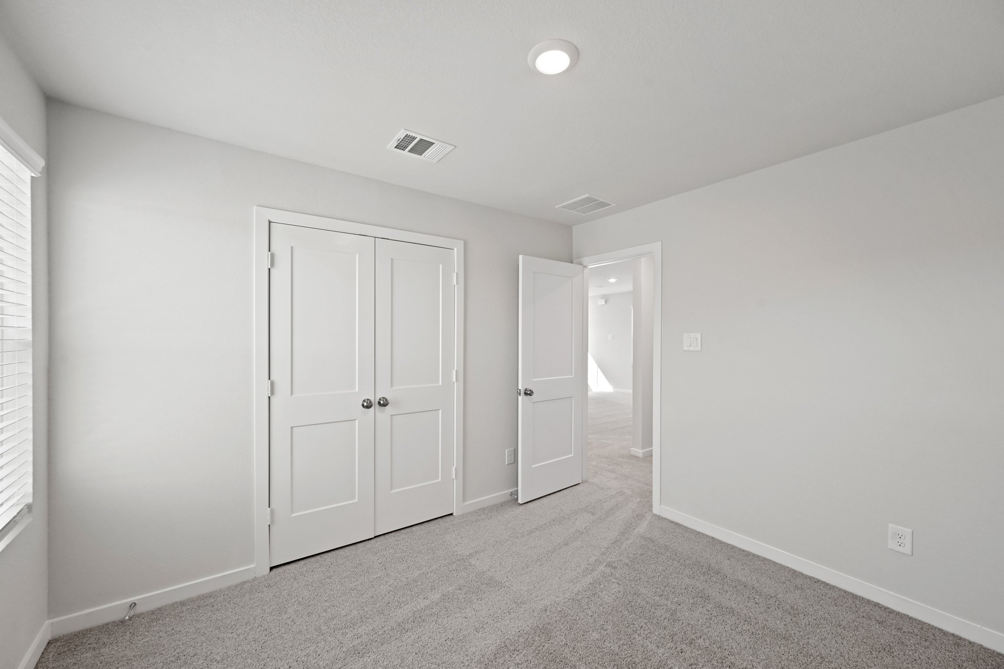 A room with white doors.