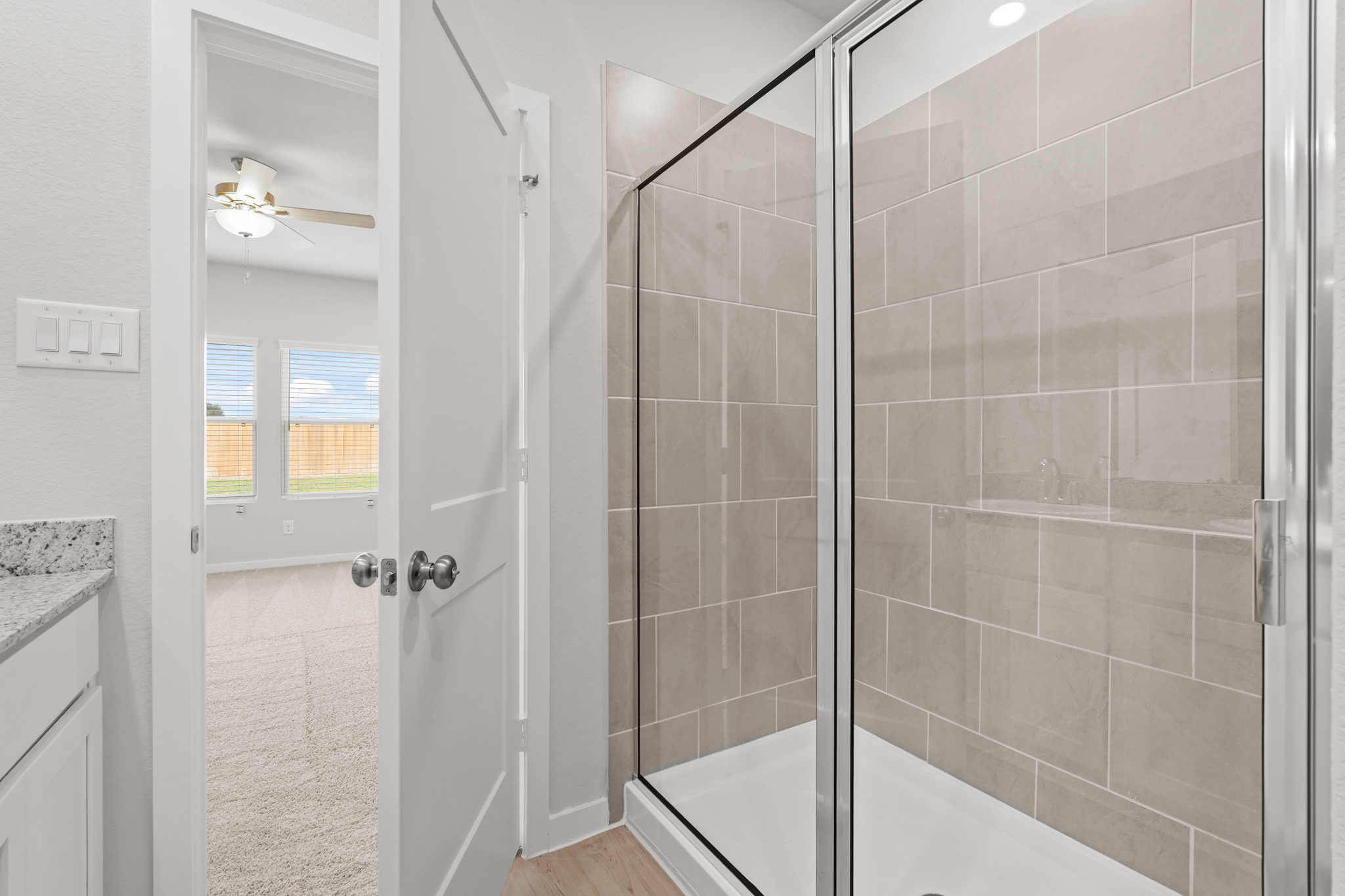 A bathroom with a glass shower.