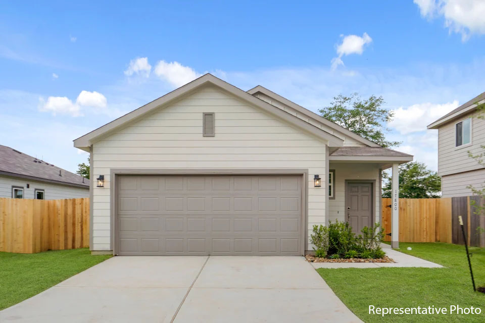 A house with a garage with American Gothic House in the background.