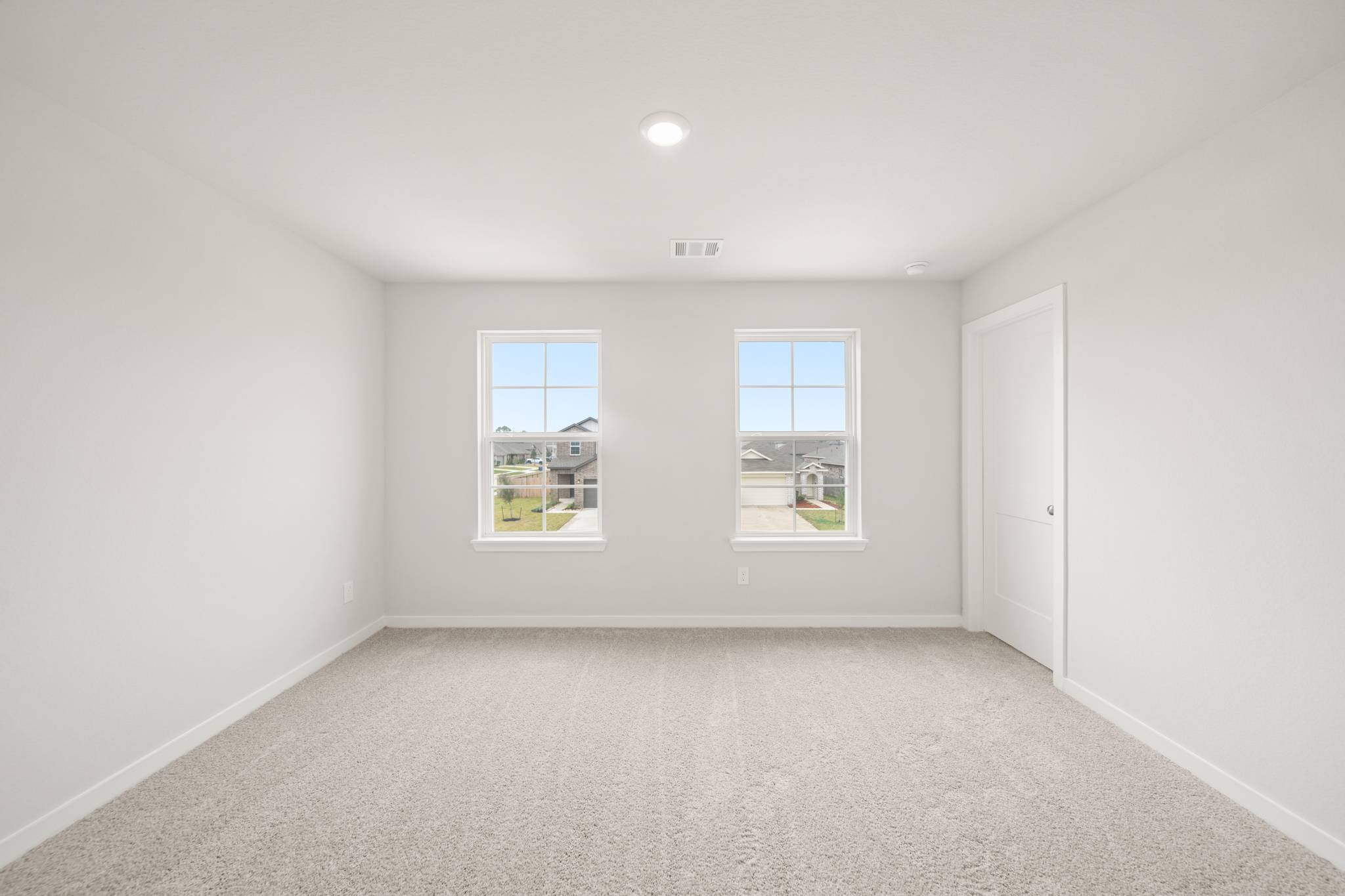 A room with a window and a door.