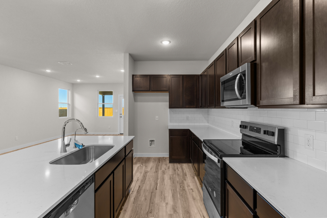 A kitchen with black appliances.