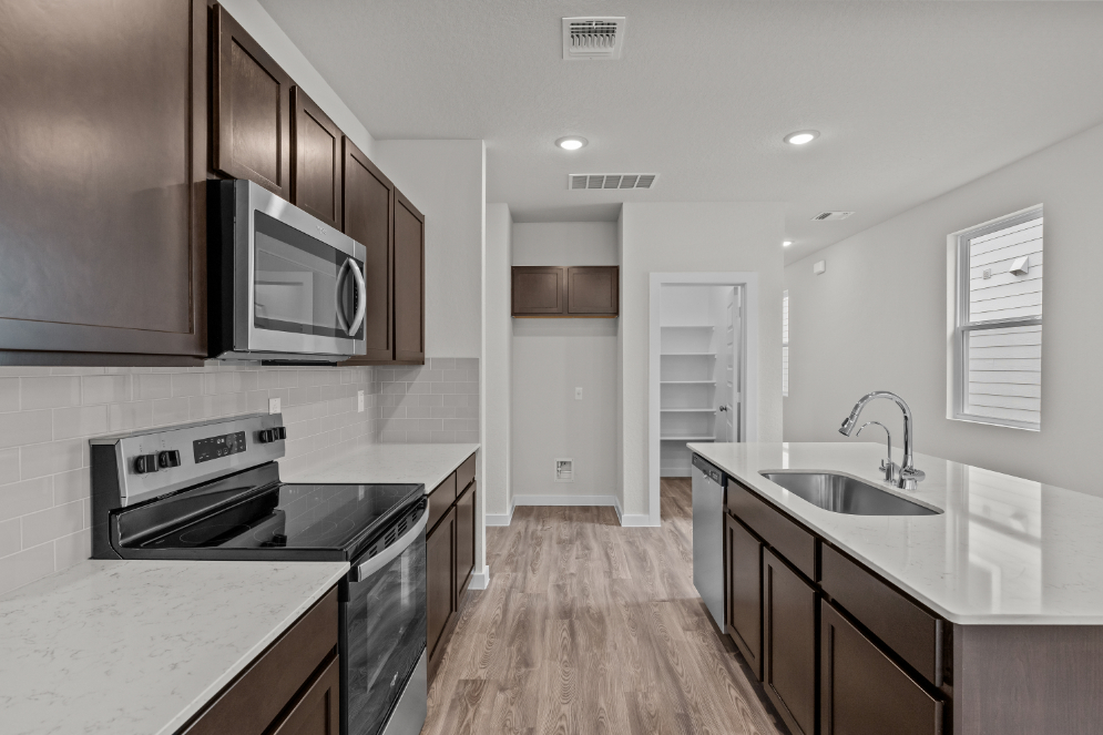 A kitchen with black appliances.