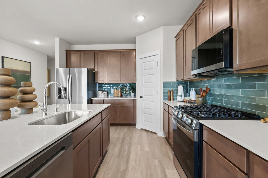 A kitchen with wooden cabinets.