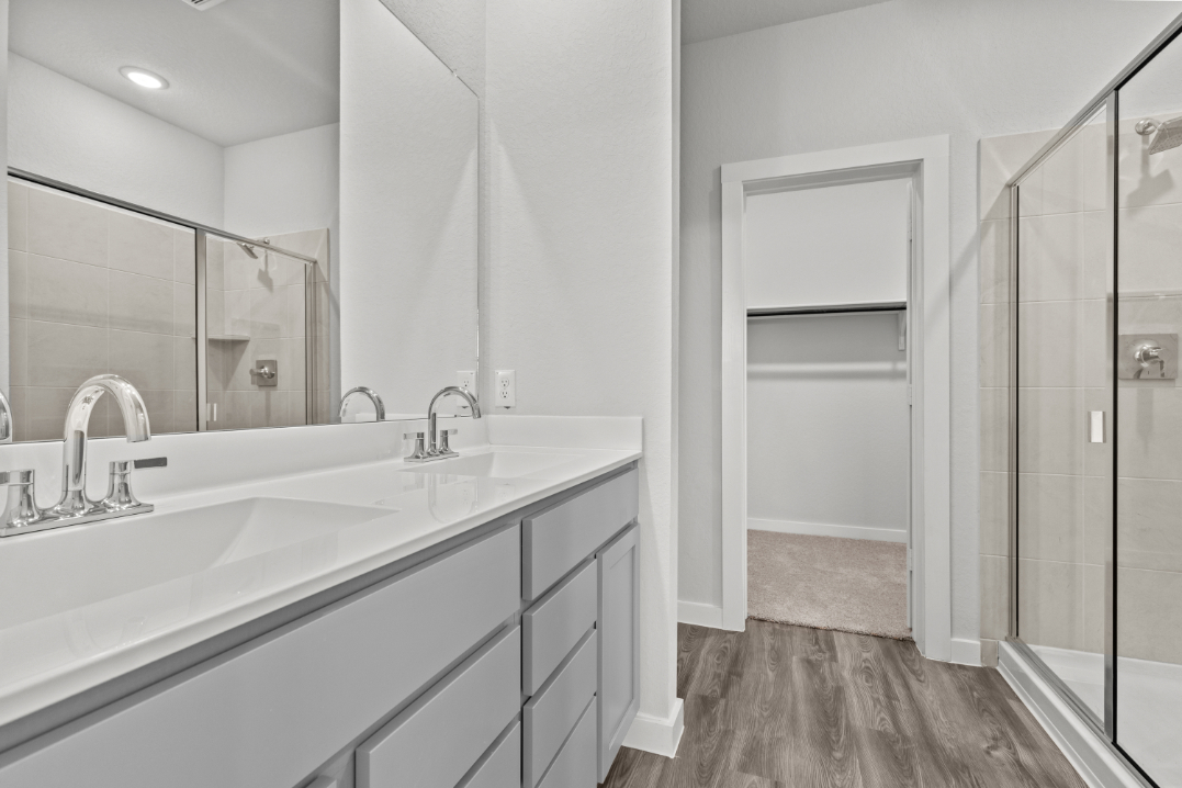 A bathroom with a glass shower.
