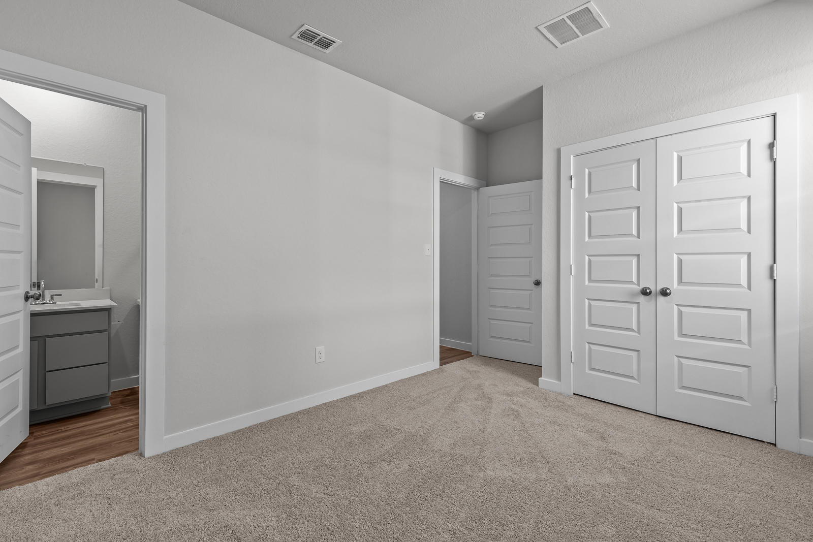 A room with white cabinets.